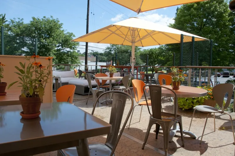 Café Sweet Street outdoor seating beside planted borders
