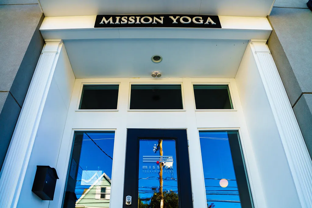 Mission Yoga sign above the Scranton studio entrance