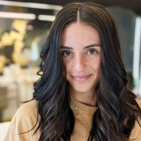 Long brunette hair styled in waves at Saskia Salon