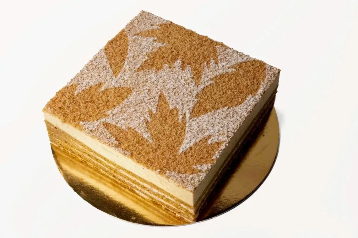 Layered cake with a stenciled leaf pattern