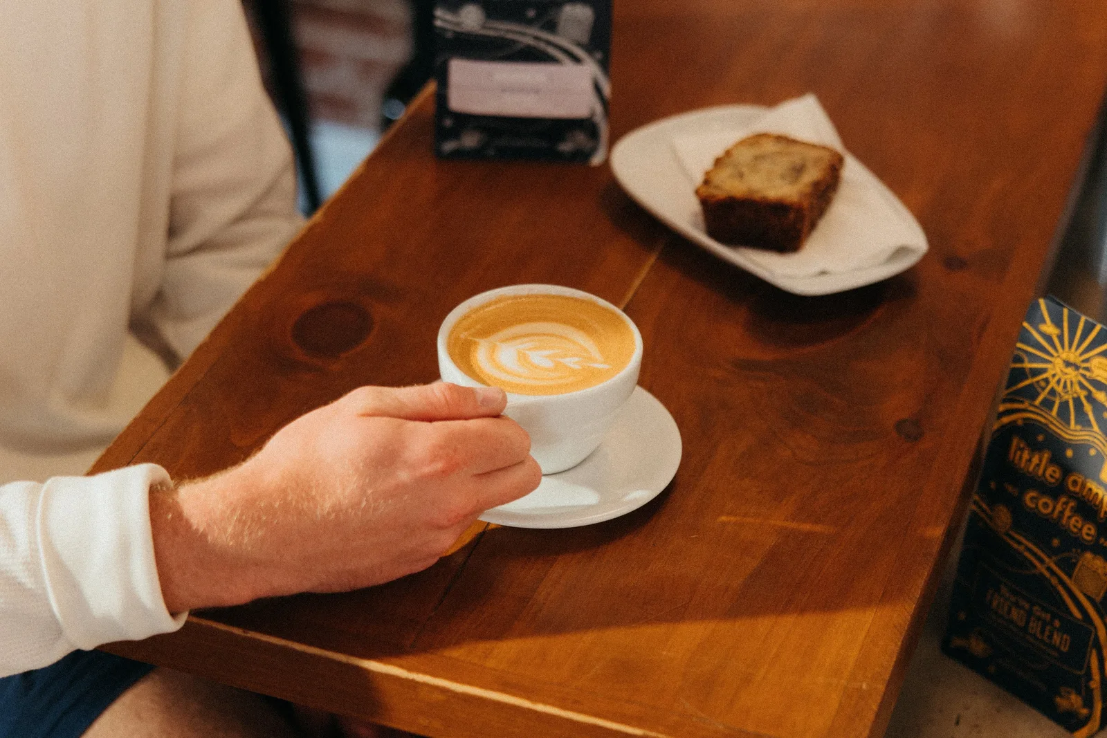 Latte and cake on a café table