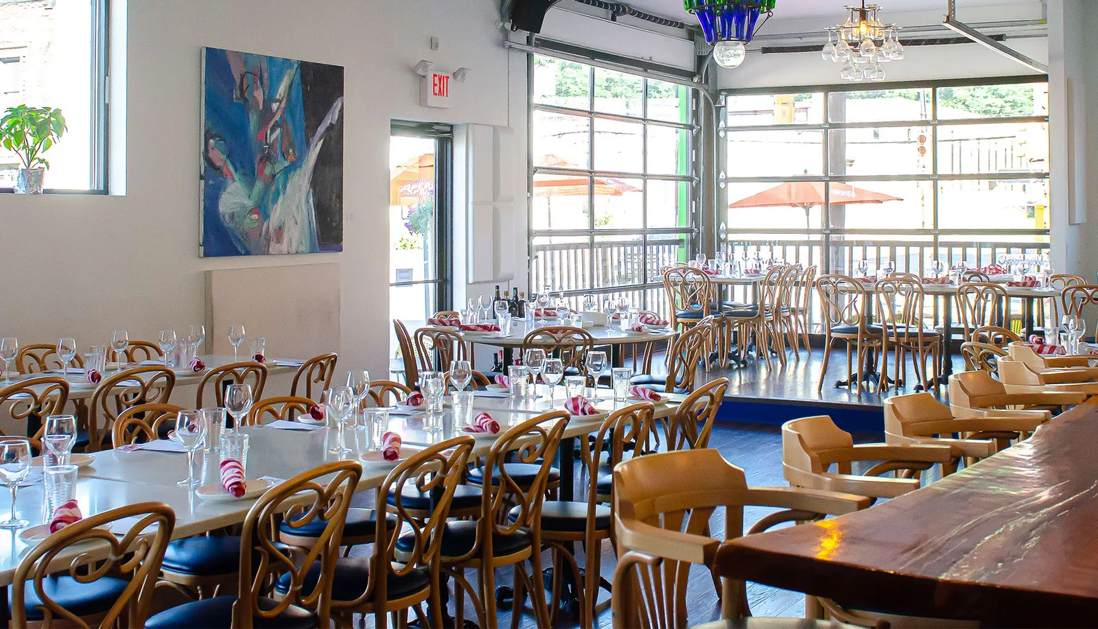 Empty DiAnoia’s dining room with tables and large windows
