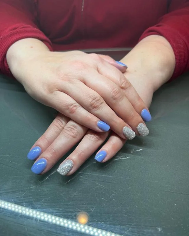 Blue and purple gradient manicure on hands