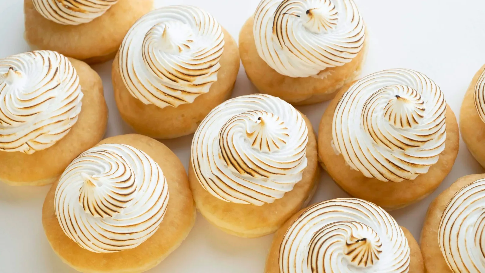 Rows of iced pastries from Vegan Treats