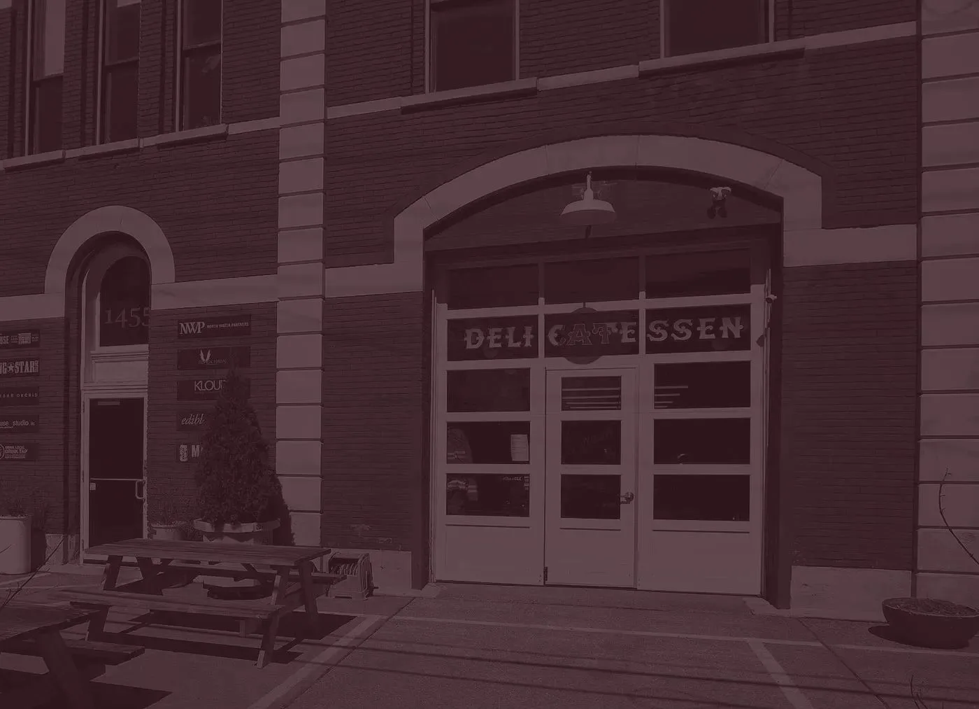 Brick building with a Delicatessen sign