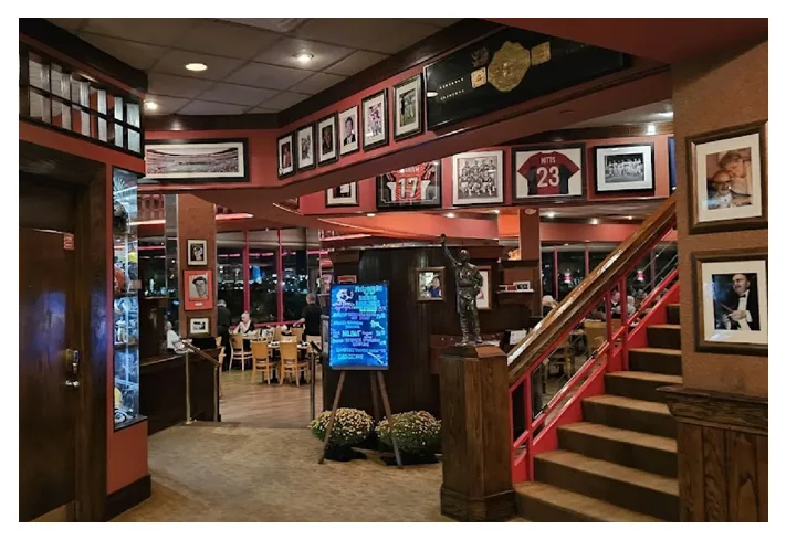 Interior with framed sports memorabilia and a staircase