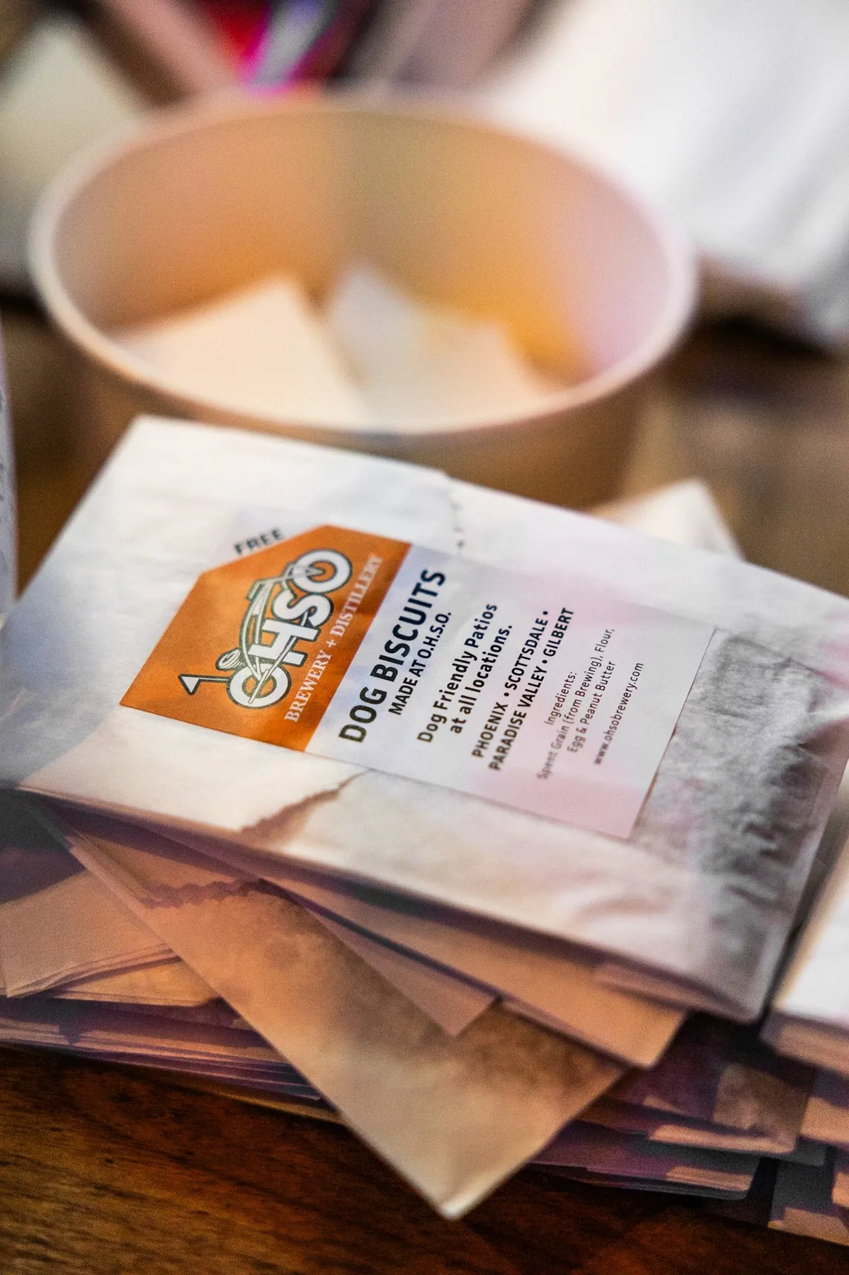 Bags of O.H.S.O. dog biscuits on a table