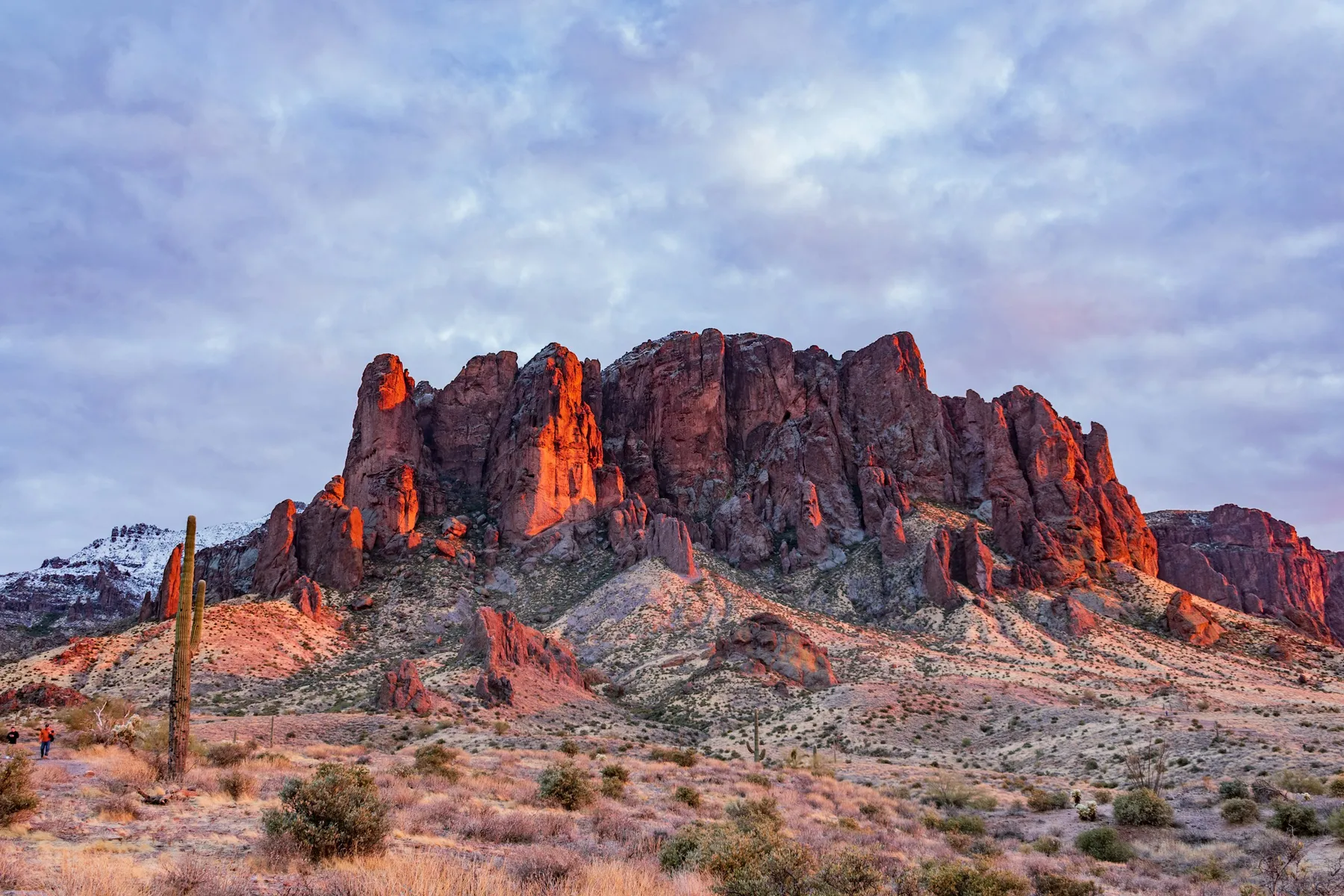 The red cliffs of the Superstition Mountains lit by the setting sun