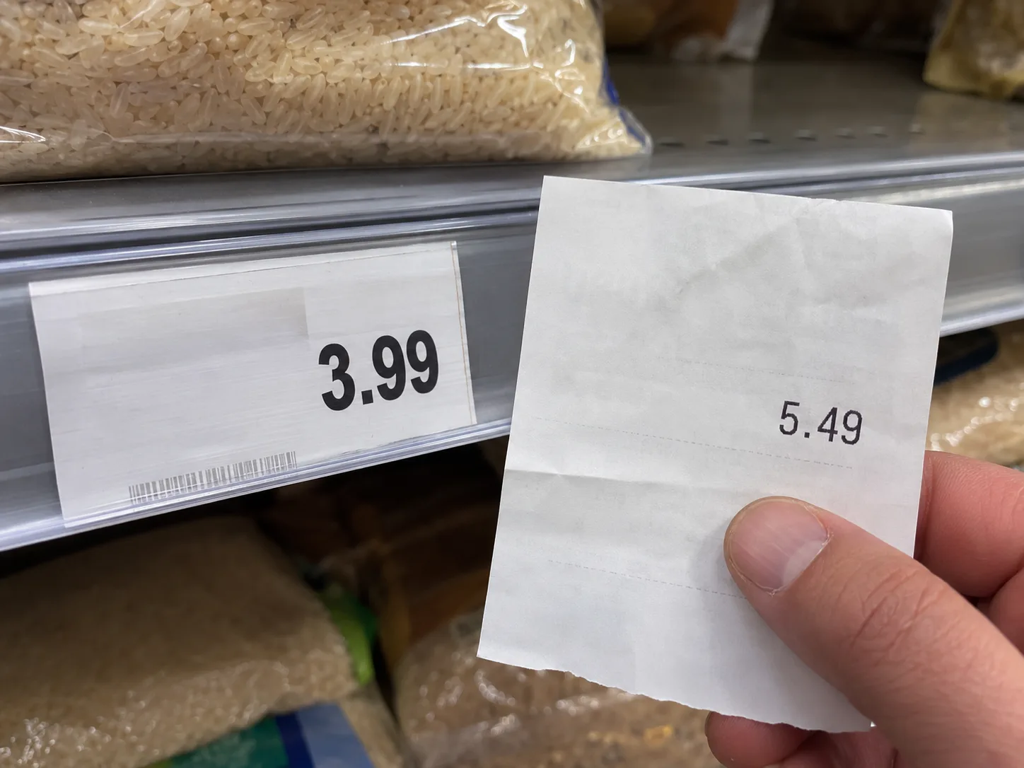 A shelf tag showing 3.99 beside a receipt showing 5.49